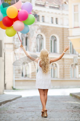 Image of woman with colorful balloons