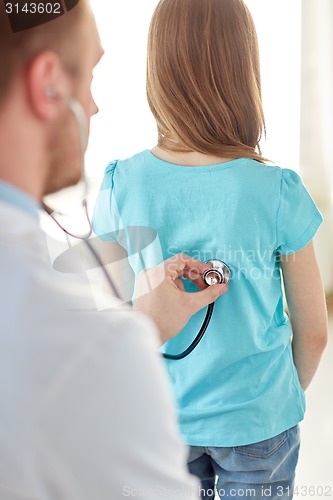 Image of close up of girl and doctor on medical exam