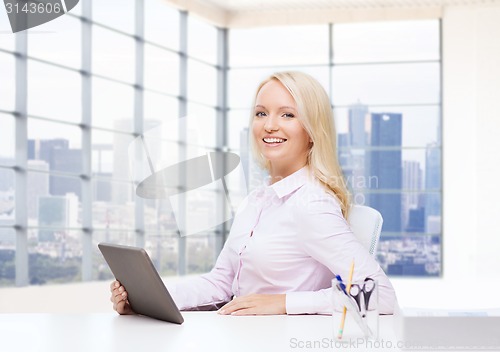 Image of smiling businesswoman or student with tablet pc