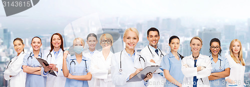 Image of smiling female doctors and nurses with stethoscope