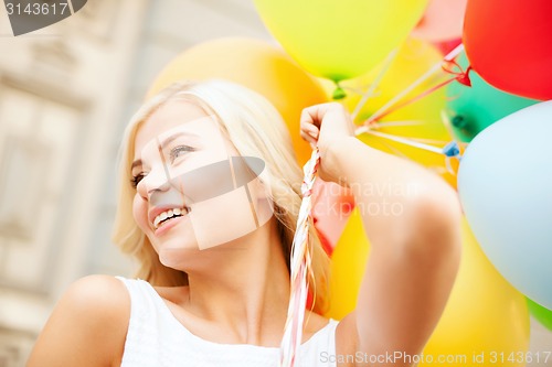 Image of woman with colorful balloons