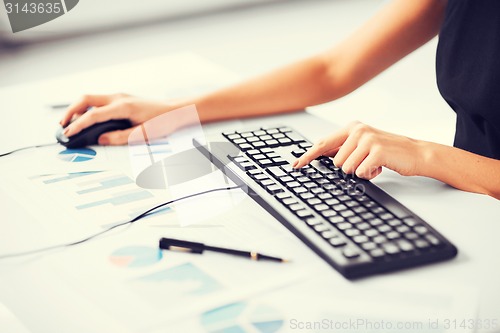 Image of woman hands typing on keyboard