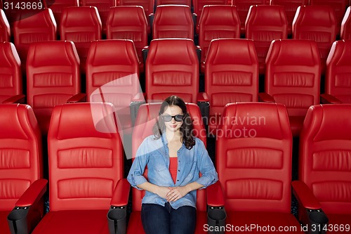 Image of young woman watching movie in 3d theater