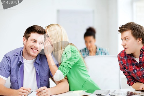 Image of group of students gossiping at school