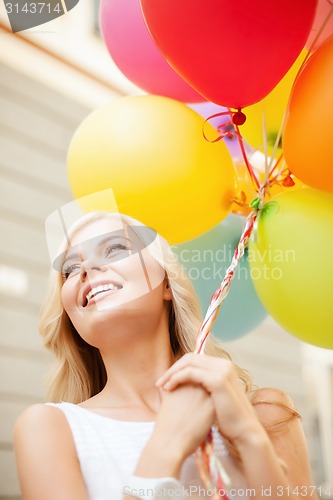 Image of woman with colorful balloons