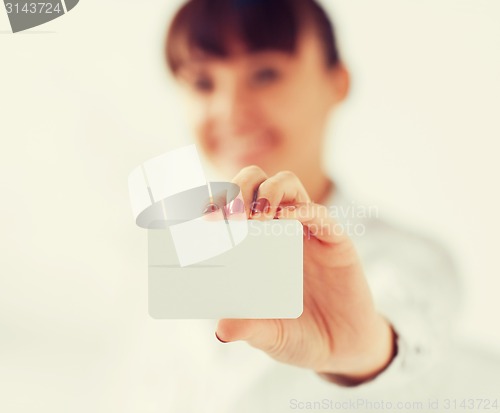 Image of businesswoman showing blank card