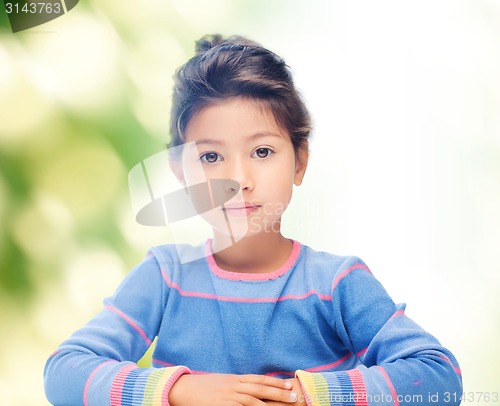 Image of little girl over green background