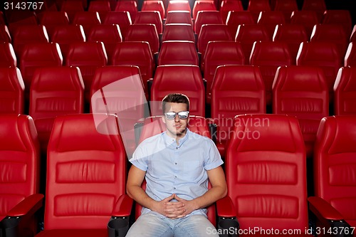 Image of young man watching movie in 3d theater