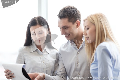 Image of business team looking at clipboard