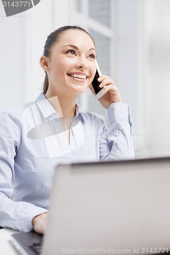 Image of smiling businesswoman with laptop