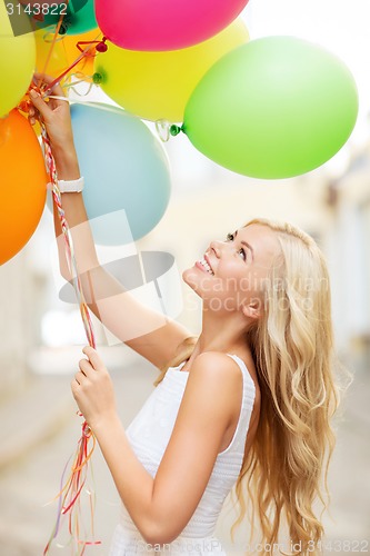 Image of woman with colorful balloons