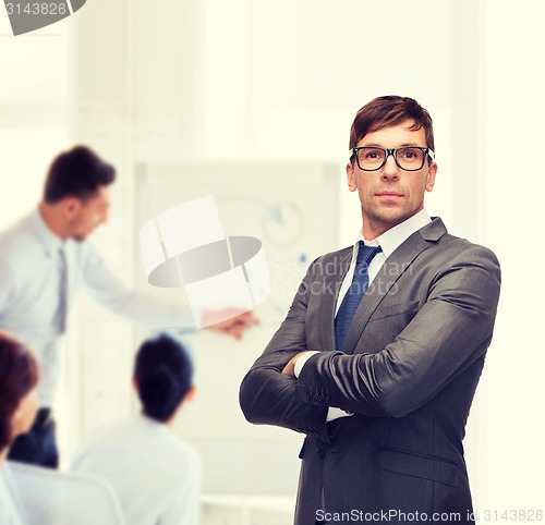 Image of attractive buisnessman or teacher in glasses