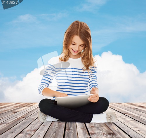 Image of happy little student girl with tablet pc