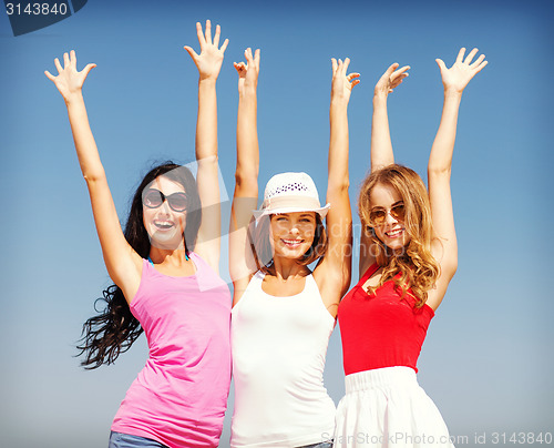 Image of group of girls chilling on the beach