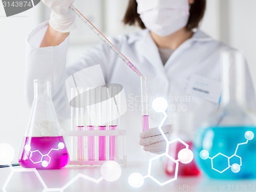 Image of close up of scientist making test in lab