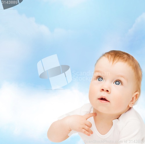 Image of curious baby looking up