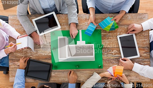 Image of close up of business team with project layout