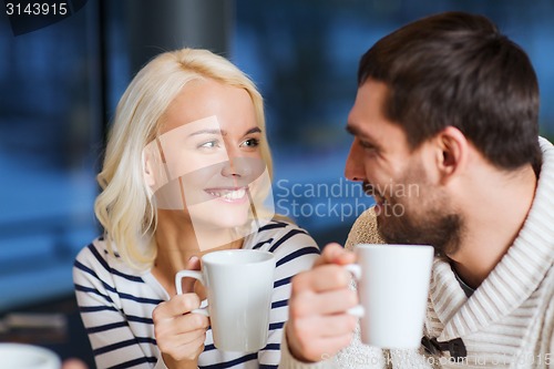 Image of happy couple meeting and drinking tea or coffee