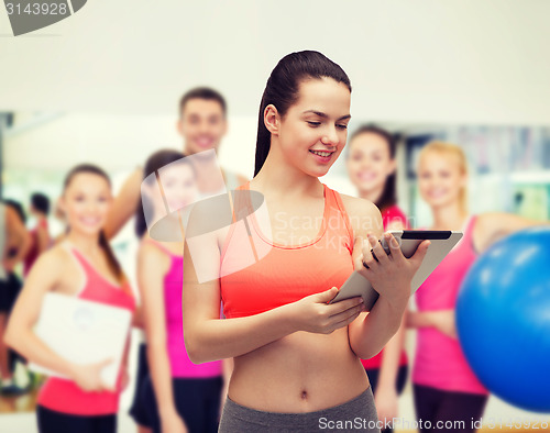 Image of sporty woman with tablet pc computer