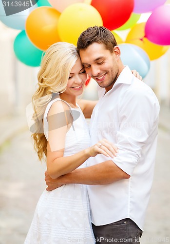 Image of couple with colorful balloons