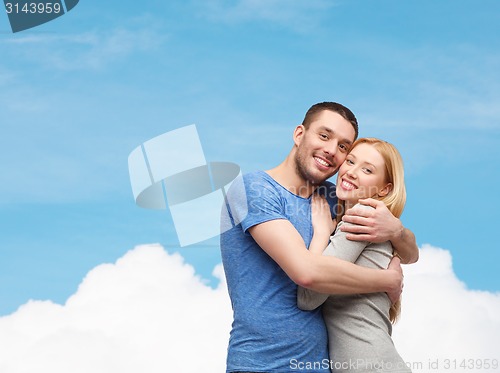 Image of smiling couple hugging
