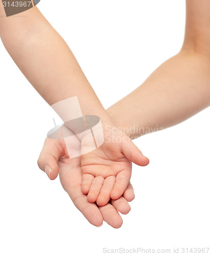 Image of close up of woman and little child hands together