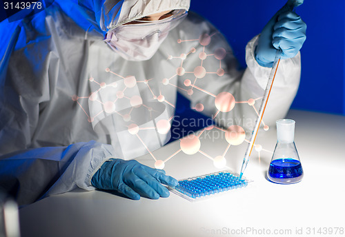 Image of close up of scientist making test in lab