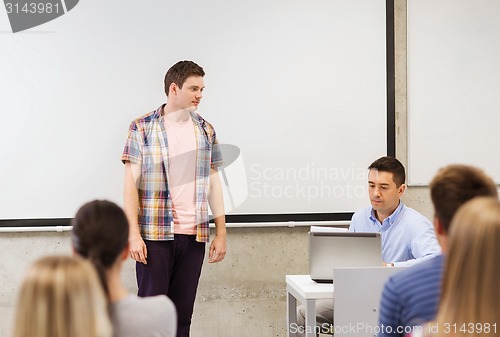 Image of group of students and teacher in classroom