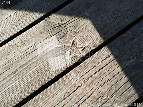 Image of sand star on boards