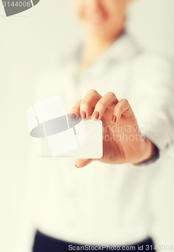 Image of businesswoman showing blank card