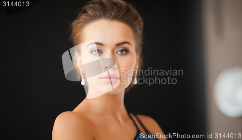 Image of woman with diamond earrings