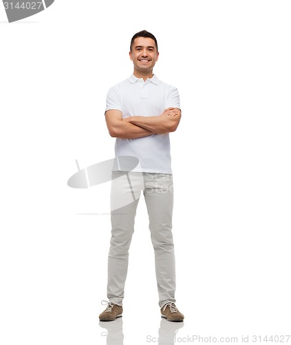 Image of smiling man with crossed arms