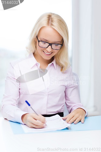 Image of smiling businesswoman or student with laptop