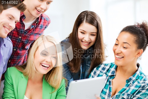 Image of students looking at tablet pc in lecture at school