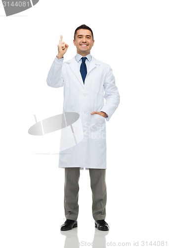 Image of smiling doctor in white coat pointing finger up