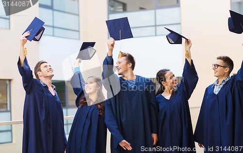 Image of group of smiling students in mortarboards