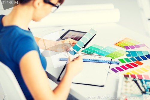 Image of woman working with color samples for selection