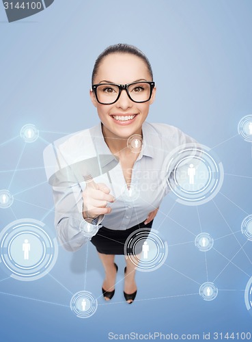 Image of smiling businesswoman with finger up