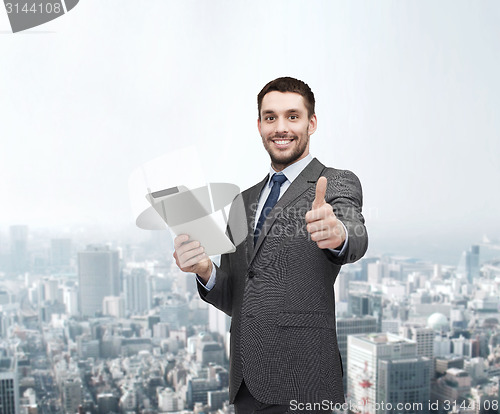 Image of smiling buisnessman with tablet pc computer