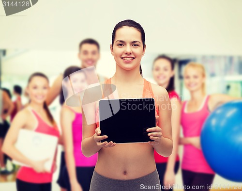 Image of sporty woman with tablet pc blank screen