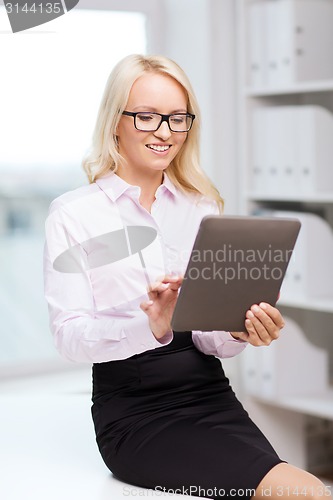 Image of smiling businesswoman or student with tablet pc