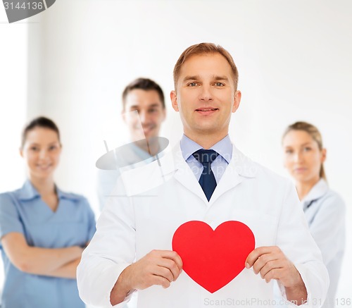 Image of smiling male doctor with red heart