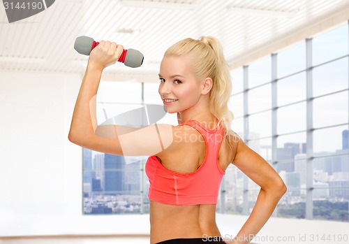 Image of close up of sporty woman flexing her bicep