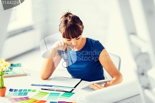 Image of woman working with color samples for selection