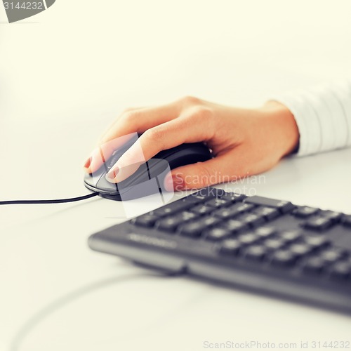 Image of woman hands with keyboard and mouse