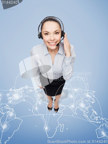 Image of friendly female helpline operator with headphones