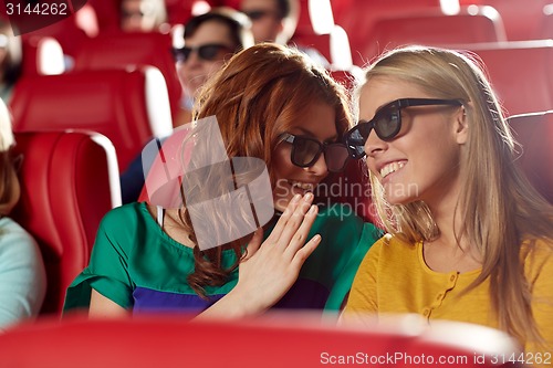 Image of happy friends watching movie in 3d theater