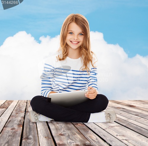 Image of happy little student girl with tablet pc