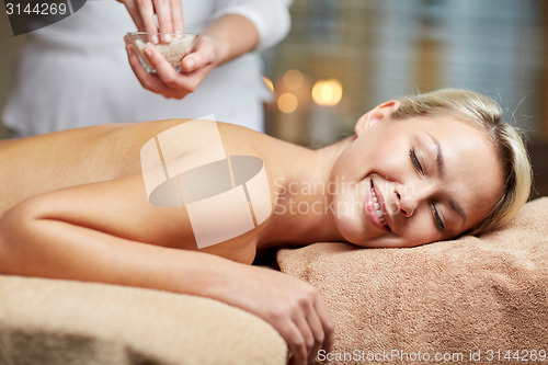 Image of close up of woman lying and having massage in spa