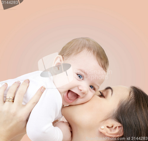 Image of laughing baby playing with mother